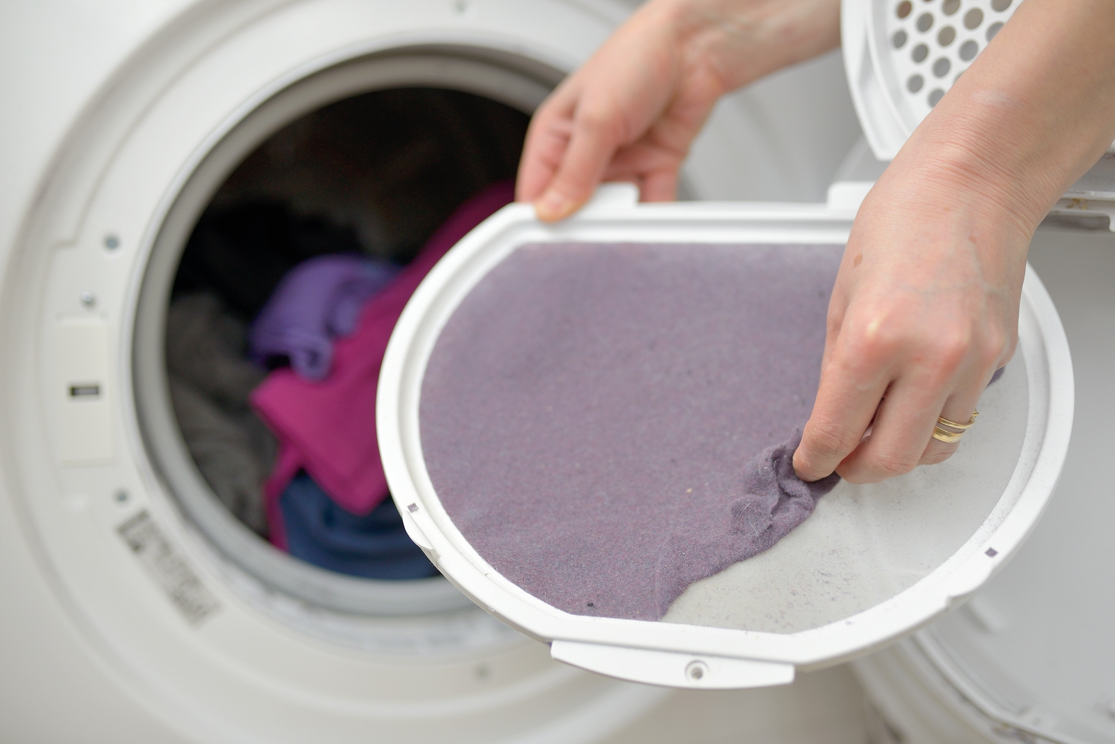 bigstock-Woman-Taking-the-lent-of-Dryer-177513745