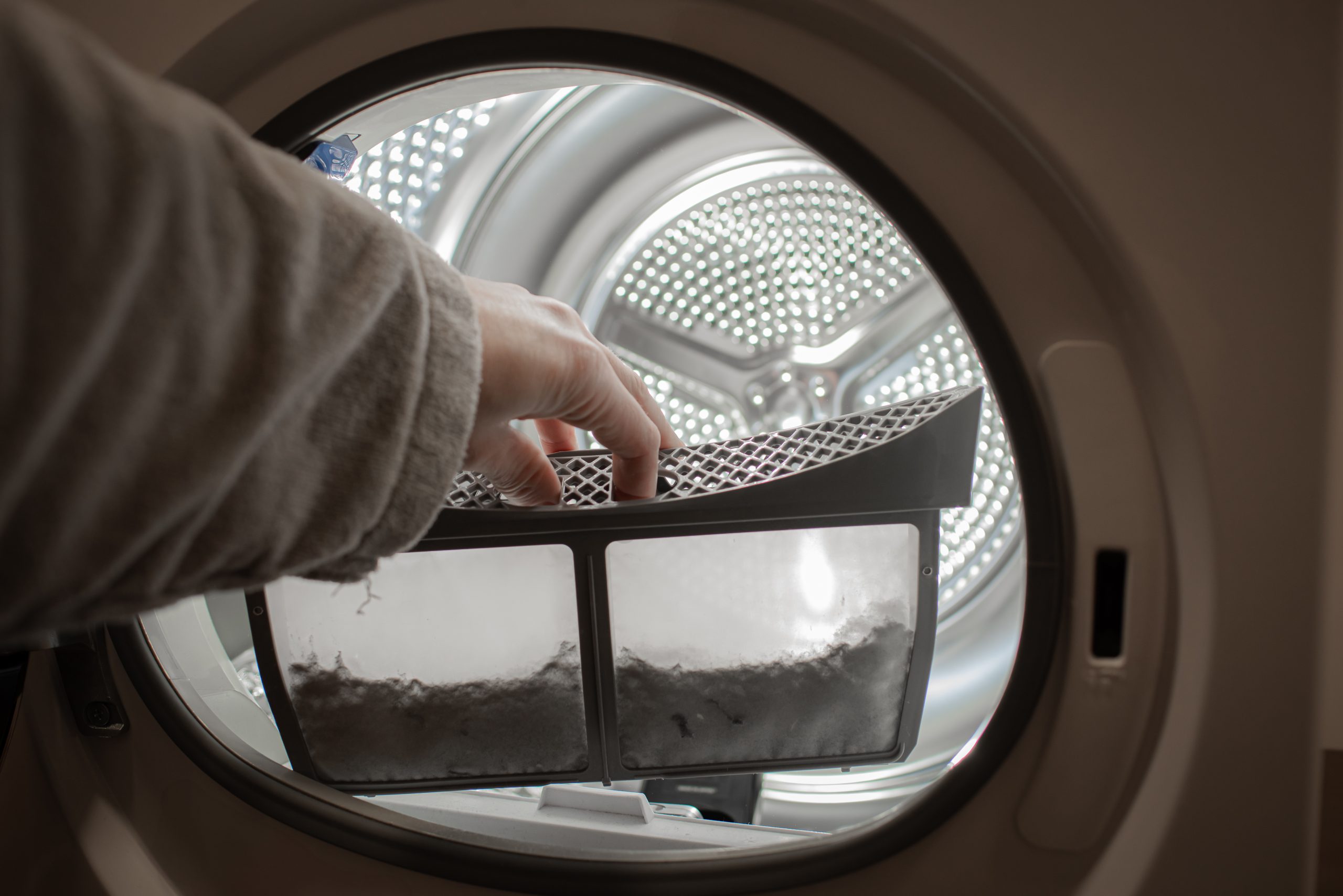 lint-trap-being-emptied-from-clothes-dryer-2026-09-23-01-42-39-utc-scaled